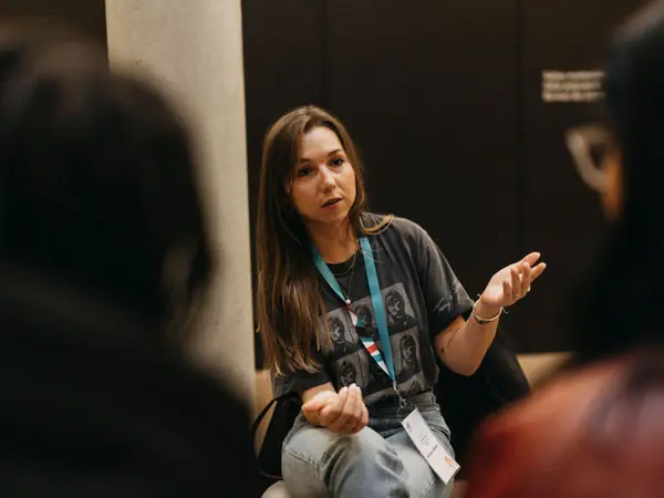 A scientist talking with a small group of students