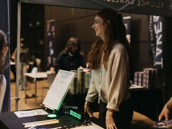 Students talking with an exhibitor at her stand