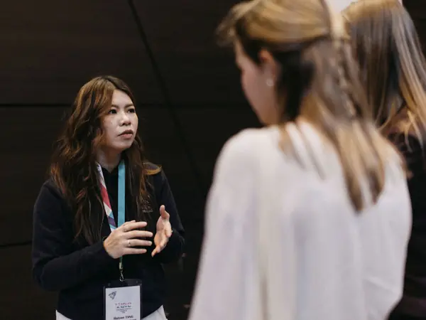 An exhibitor talking with a student